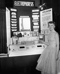 Photo of young woman at electrical display