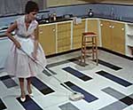 Woman mopping a floor, 1960s