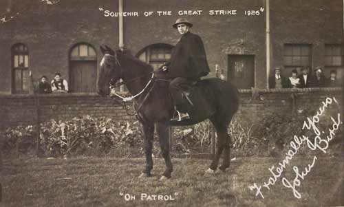 A black and white photo of a man sitting on a horse. Text reads "Souvenir of the Great Strike 1926", "On patrol", "Fraternally Yours, John Bird".