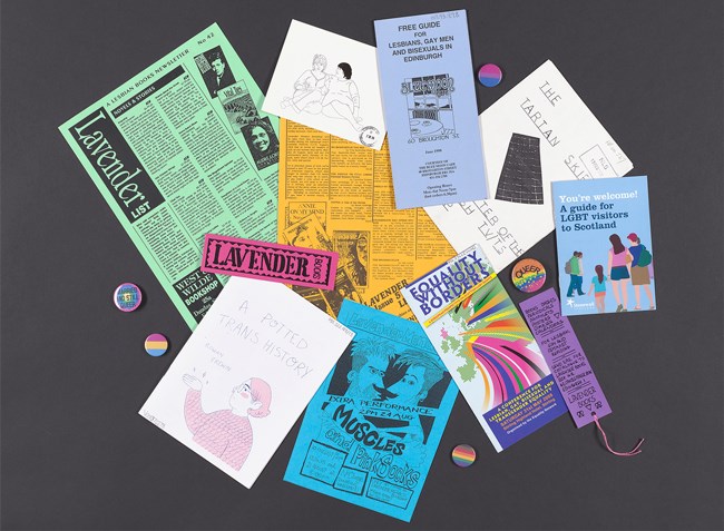 A collection of LGBQT+ ephemera including colourful pamphlets, zines and badges.