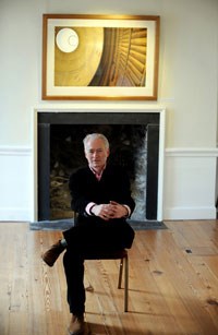 A photo of Hugh Buchanan sitting in a room.