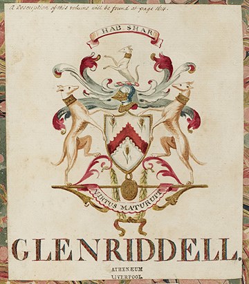 Glenriddell Crest. There are dogs on either side and one in the middle on top of a armoured helmet.