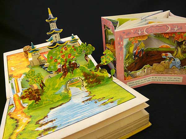 A photo of two colourful children's pop-up books.