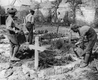 First World War soldiers tending graves