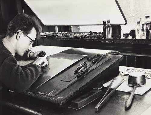 Man engraving a map