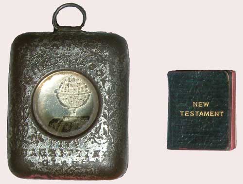 A miniature book with silver locket that it was kept in