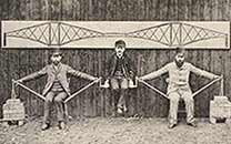Three men demonstrating a cantilever bridge