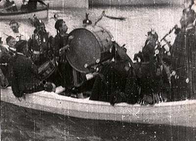 Film still - pipers in a small boat