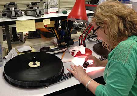 Examining 35mm film at the winding bench