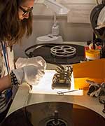 Woman looking at film over a lightbox