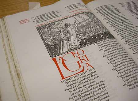 Photo of an illustrated page with red ornate lettering