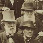 Detail from a black and white photograph showing men's faces