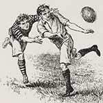 Two boys playing rugby