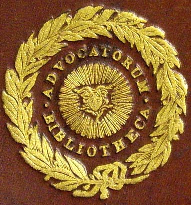 Gilt stamp with laurel wreath