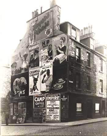 Photo of building with advertisements on gable end