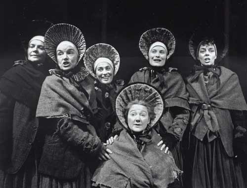 Photo of women in costume wearing large bonnets