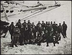 Group of men in front of ship