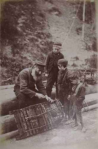 Boys watching fisherman