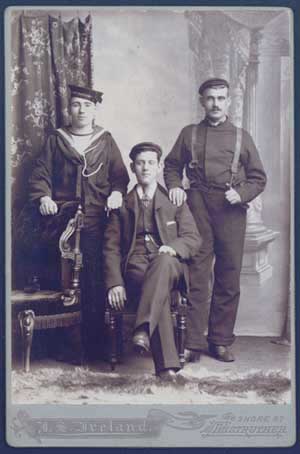 Photo of three men in working clothes