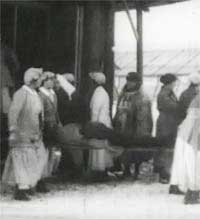 Photo of nurses carrying a stretcher