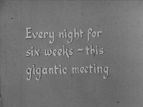 An intertitle still from a silent film that reads "Every night for six weeks - this gigantic meeting".