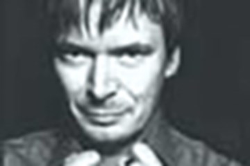 A black and white close up portrait photo of Ian Rankin.