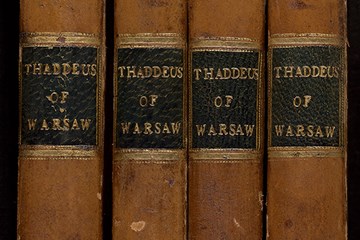 The spines of four volumes of Thaddeus of Warsaw.