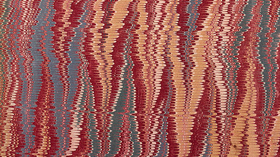 The inside cover of a book featuring an abstract pattern of wavy, vertical lines in red, blue, and beige, creating a marbled effect.