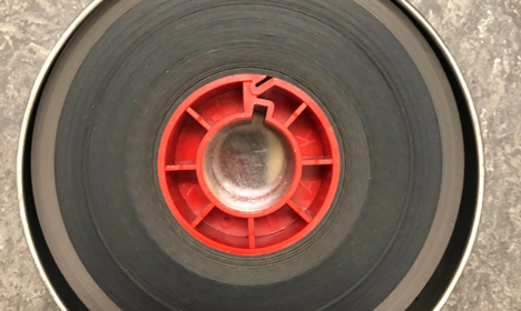 A rolled up film filling a can.