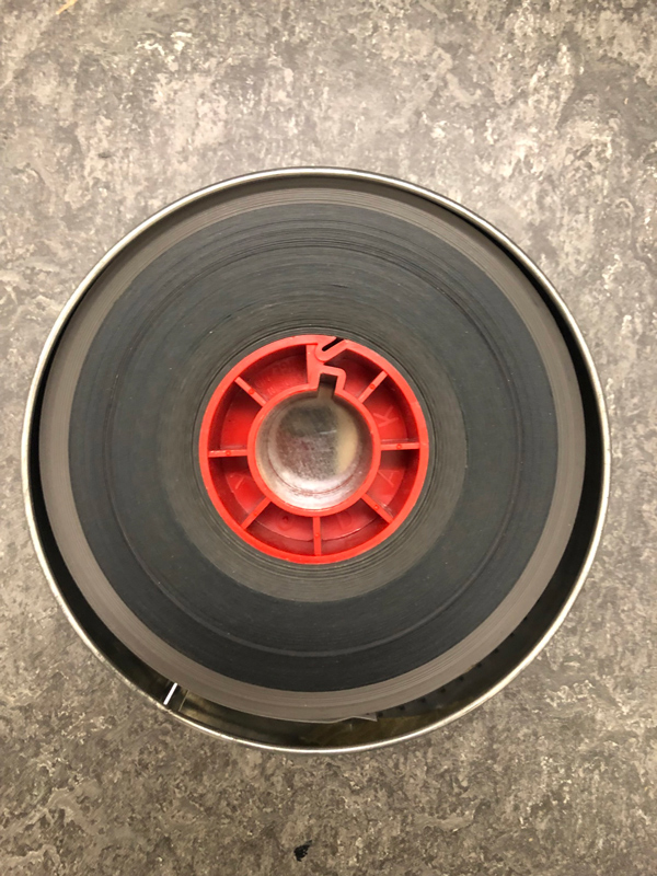 A rolled up film filling a can.