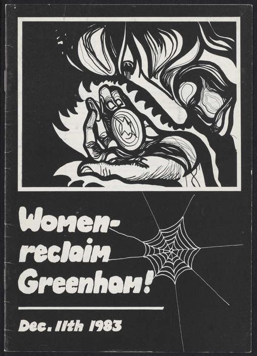 Black and white cover showing a hand holding anobject, with detailed line work. Below the image is the text: 'Women—reclaim Greenham! Dec. 11th 1983.'