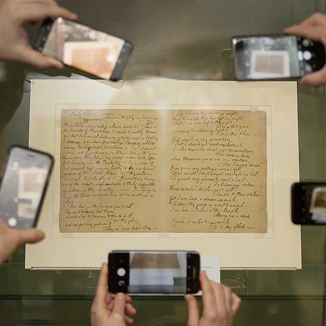 A manuscript being photographed