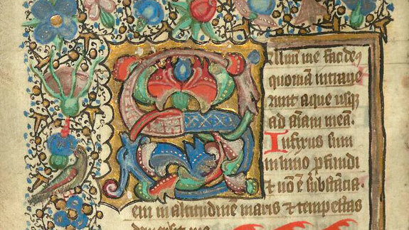 A richly decorated illuminated manuscript page featuring Latin text. The borders are adorned with intricate floral and vine motifs. A large, colorful initial 'S' begins the text, and some lines are highlighted in red ink for emphasis.
