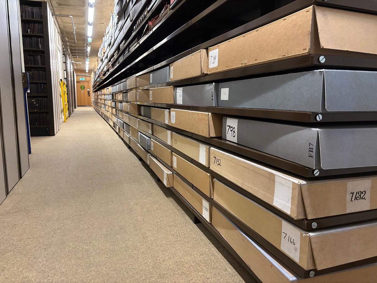 Boxes on shelves down a long corridor.