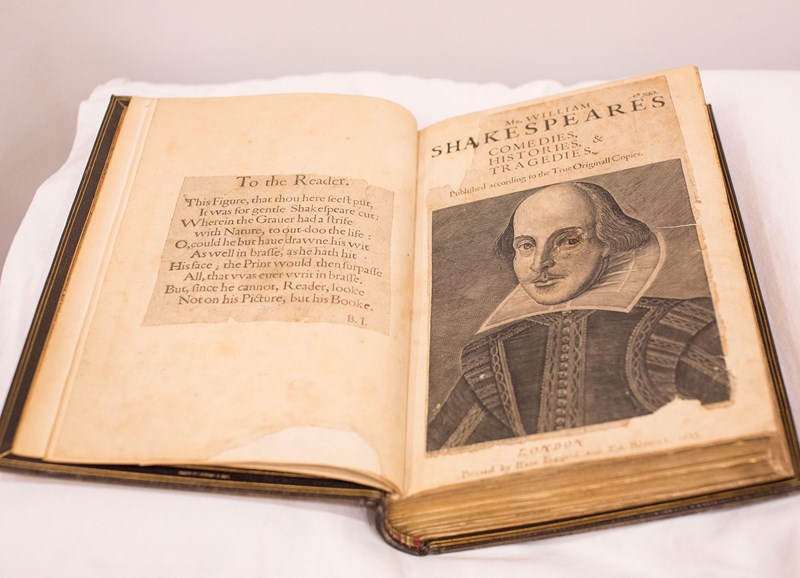 The title page of Shakespeare's first folio. On the lefthand side is a greeting to the reader. On the righthand side is the title and an illustration of Shakespeare. The title says 'Mr. William Shakespeares Comedies, Histories, & Tragedies'.