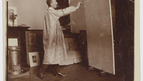 S. J. Peploe painting in his studio.