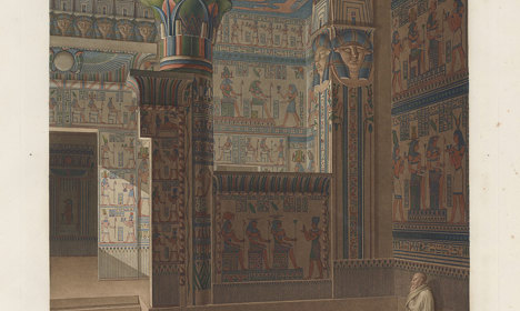 Coloured illustration of an ornate temple interior with painted columns, hieroglyph-covered walls, carved figures and a seated figure in the foreground.