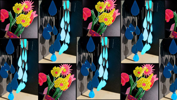 A collage of colourful cardboard flowers and raindrops.