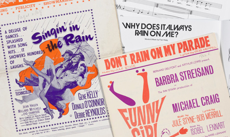 A collage of rain-themed songs including 'Singin' in the Rain' and 'Don't Rain on my Parade'.