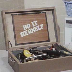 Open tool box, with 'Do it herself' text on the lid