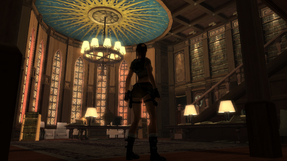 Lara Croft stands in a grand circular library with high shelves, desks, and a large chandelier overhead.