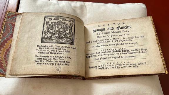 Two-page spread from a 1682 music book titled 'Songs and Fancies', featuring a poetic dedication and publication details from Aberdeen.