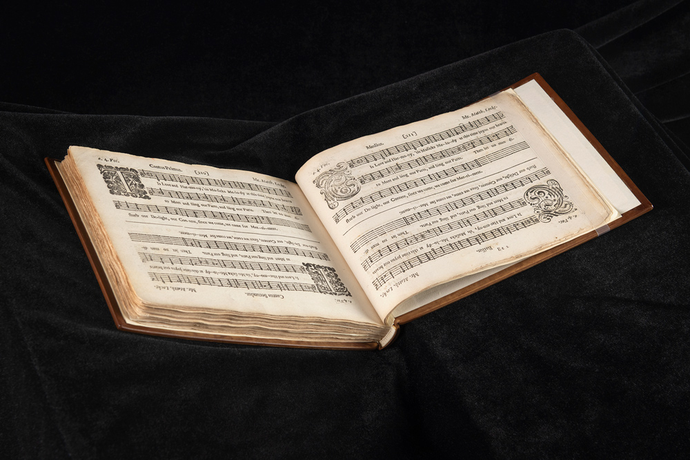 An open book of musical score.