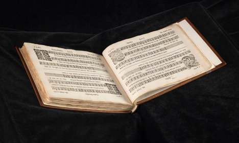 An open book of musical score.