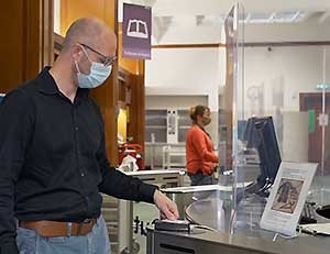 Man in mask at Library