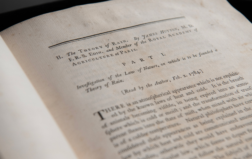 Open pages of the book 'Theory of Rain' by James Hutton.