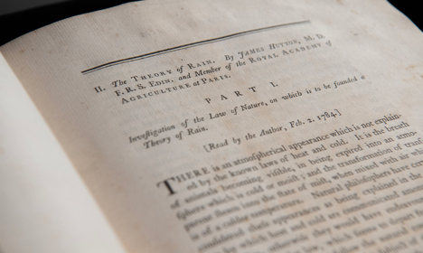 Open pages of the book 'Theory of Rain' by James Hutton.