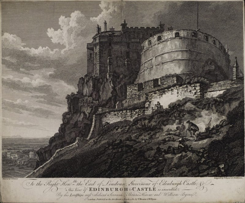 A large stone castle sitting on a rocky hill.