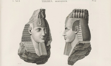Engraving showing two large carved stone heads, alongside smaller drawings of chariots, figures and a fragment of a colossal foot.