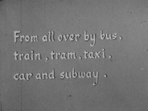 Intertitle screenshot from a film that says "From all over by bus, train, tram, taxi, car and subway."